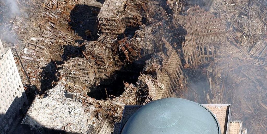 A view over the dome of WFC2 shows the damage to WTC6 in the center of the photo. To the left is the collapsed WTC7.